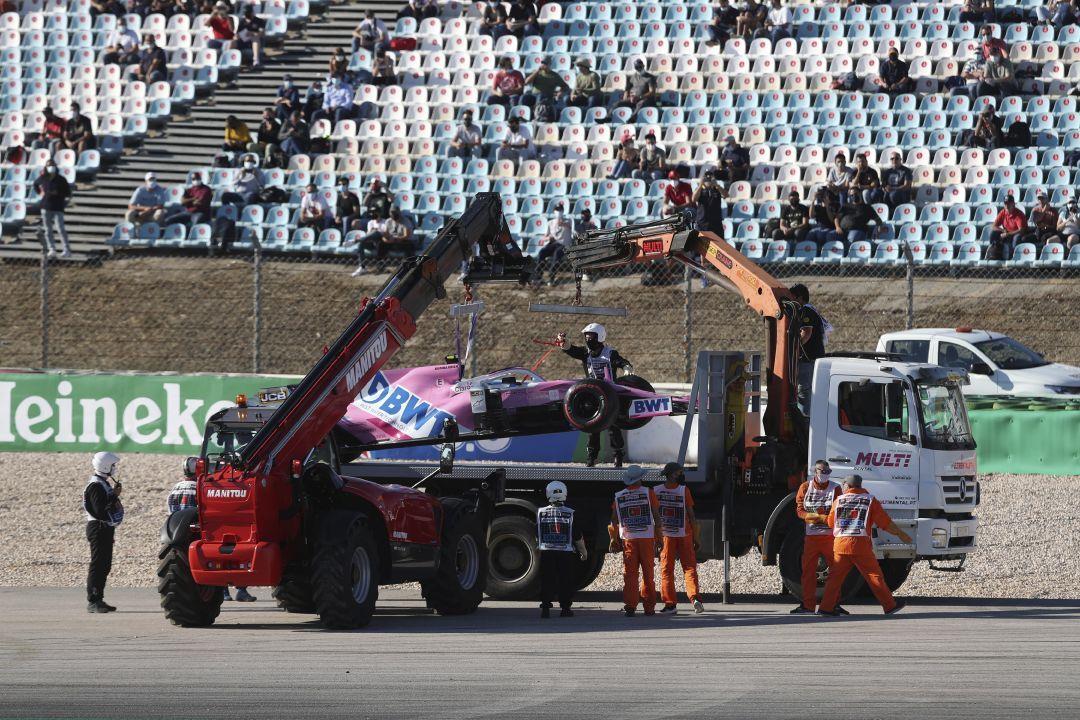 Track Marshals Remove The Car Of The Racing Point Driver Lance Stroll Of Canada During The Second Practice Session Prior To The Formula One Portuguese Grand Prix At The Algarve International Circuit