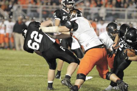 independent kevin whitlock n perrys 62 michael caughey  is blocked by massillons nate devers as perrys 27 braxton berry runs the ball in last years matchup