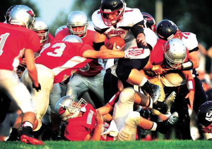 times reporter pat burk n indian valleys jake davis hurdles his way through sandy valley defenders during fridays game in magnolia