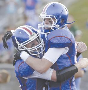 lakes clay shreve left hugs teammate dalton davis after davis scored the blue streaks first touchdown in the first quarter of their game against green