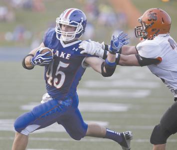 lakes matt blasiole left fights off greens drew dawson on a second quarter run that got down to the green two yard line a play later blasiole scored lakes second td of the game