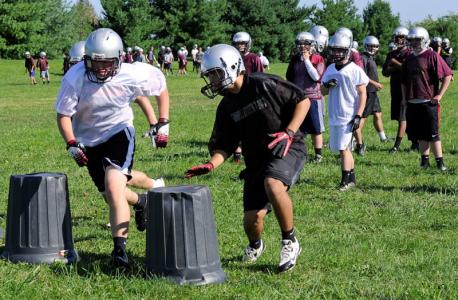 winters mill football players run through a drill at practice