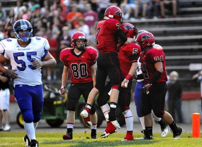 north carrolls aaron heinle celebrates with teammate coby lowe after lowe scored a touchdown against williamsport