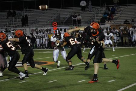 green quarterback john davies lets fly with a pass in the first quarter