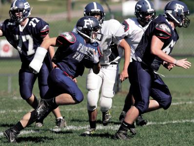 independent gleenn b dettman n jeremy mahaffey runs the ball in drills at the fairless football practice