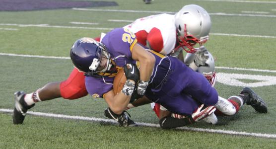 jackson sophomore tight end kevin lyons 28 holds the football tight as he is  brought down by an akron east defender in week 1 of the 2013 football season as jackson begins federal league play against lake ball security will be a key to victory