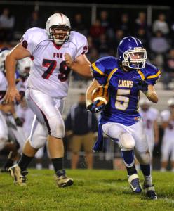 libertys ryan scheufele runs upfield in front of francis scott keys evan mcgrew at liberty friday