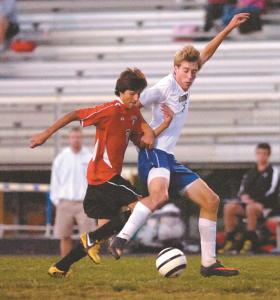 north carrolls mike mantzouris left defends as libertys seth ball moves the ball downfield during the first half of their monday night game in eldersburg sept 30 2013