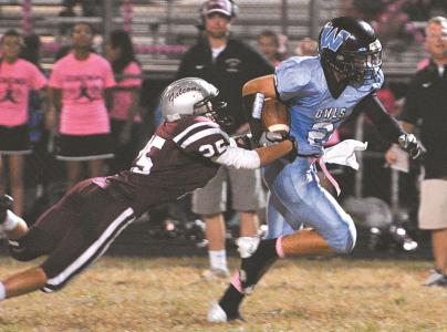 wintersmills shane vagnier tries to tackle westminsters brian kohr on friday night in westminster