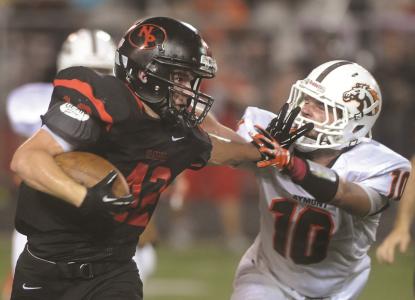 times-reporter jim cummings n new philadelphias greg cunningham stiff arms claymonts alan ruffini during a run in friday nights game at woody hayes quaker stadium