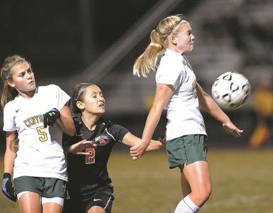 centurys alyssa malanik right deflects a ball in front of north carrolls shanelle harrell and teammate melanie bell during the first half of their game in eldersburg tuesday oct 8 2013