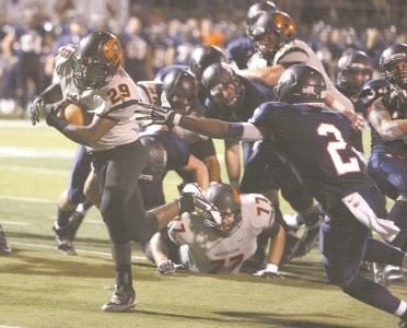 independent kevin whitlock n  massillons lyron wilson breaks the tackle of fitchs brian pressley for massillons only first half touchdown