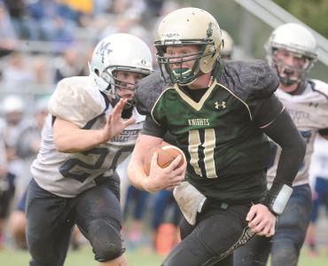 century quarterback justice guthrie runs for the game winning touchdown in front of manchester valleys jp mangold at century high school saturday oct 12
