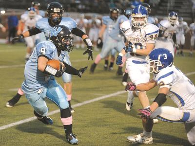 westminsters chase sankovich runs upfield in front of libertys joseph bender and logan sweeney saturday oct 12 at mcdaniel college in westminster