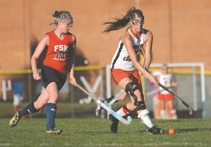 north carroll senior megan heindel drives the ball downfield as fsk sophomore alisha smith defends in the second half of the panters 3-0 win over fsk in hamsptead monday oct 14 2013