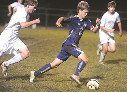 francis scott keys hunter strine drives upfield ahead of centurys brian smith and mark broomfield tuesday oct 15 at century high school