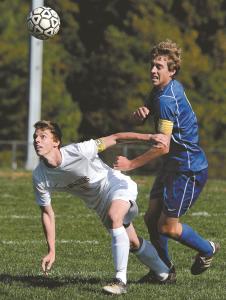 south carrolls brett basham fights for the ball with libertys seth ball friday oct 18 at south carroll high school