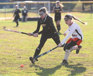 south carroll senior sarah parker left and north carroll senior bridget colman work to gain control of the ball during their playoff game in hampstead thursday oct 24 2013