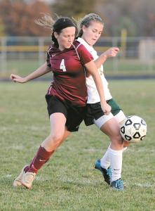 winters mill junior morgan stewart left and century senior melanie bell battle for control of the ball during the first half of their playoff game in eldersburg tuesday oct 29 2013