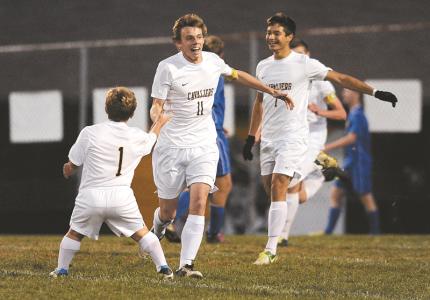 south carrolls brett basham 11 celebrates with teammates zachary shattuck left and raffy villatoro after scoring a goal in the first half of the cavaliers playoff win over liberty in winfield tuesday oct 29 2013