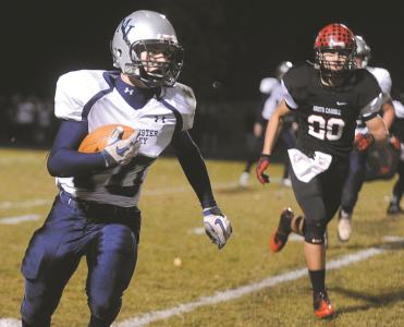 manchester valleys tommy slaysman runs upfield in front of north carrolls justin tunis friday nov 8 at north carroll high school