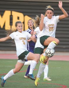 centurys hannah warther shoots and scores in front of teammate melanie bell during the 2a state championship game against loch raven at umbc in baltimore friday nov 15