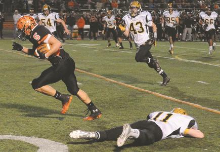 middletowns timothy schumacher runs for a touchdown in front of south carroll defenders friday nov 22 in middletown