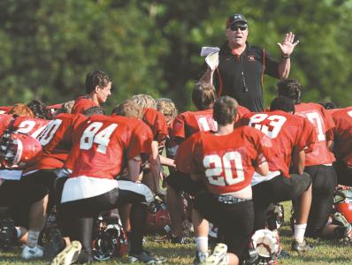 north carroll head coach matt martello talks with players following a football practice in hampstead tuesday august 20 2013