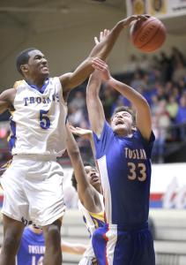 repository bob rossiter n tuslaws josh carroll is fouled from behind by timkens tariq stinson before the block by lepear toles duringin the third quarter