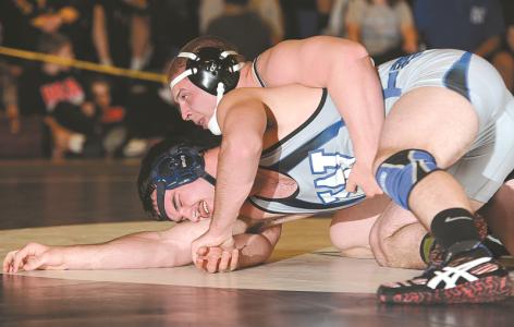 winters mills jake utz wrestles williamsports lasher urciolo during their 220-pound match in williamsport saturday march 1