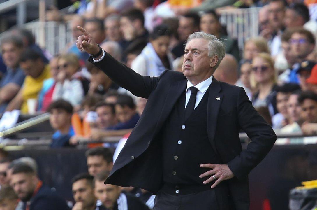 FILE - Real Madrid coach Carlo Ancelotti gives instructions to 