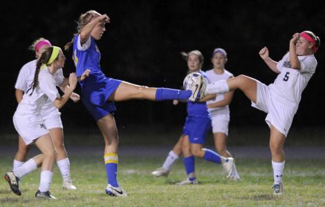 manchester valleys beanie colson left and allie little right battle libertys leah wolf third from left for a ball in the first half of a high school soccer game tuesday oct 14 2014 in manchester photo by steve ruark for the baltimore sun no m