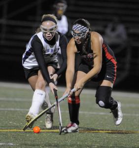annapolis md-11314-loch raven 26 jesse sartor and north carroll 3 molly pickard fight for a first half loose ball loch raven vs north carroll girls high school field hockey at broadneck hs   lloyd foxbaltimore sun