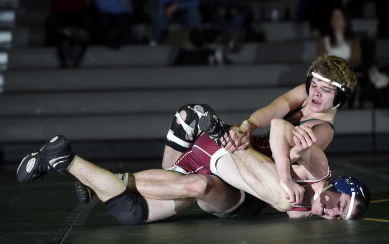 centurys teddy nava works to control fsks patrick mojica during their 138-pound bout in eldersburg wednesday jan 14 2015