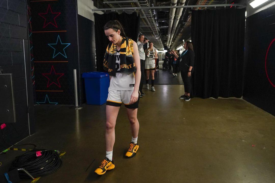 Iowa's Caitlin Clark walks to the locker room after the NCAA Women's Final Four championship basketball game against LSU Sunday, April 2, 2023, in Dallas. LSU won 102-85 to win the championship. (