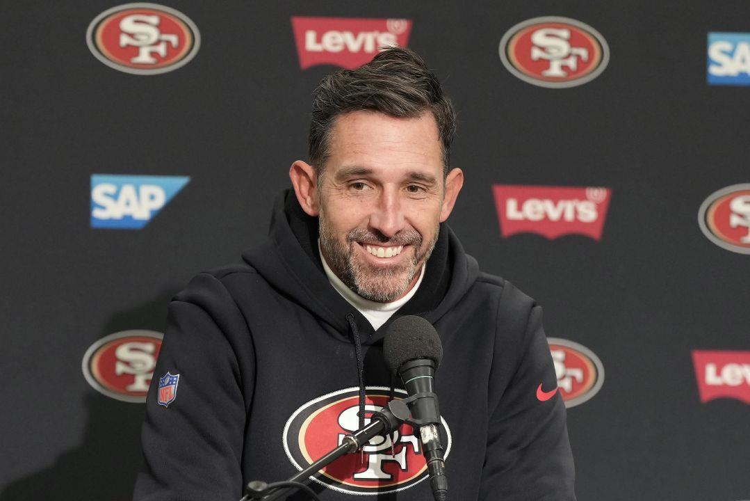 FILE - San Francisco 49ers head coach Kyle Shanahan smiles while speaking  at a news conference after the 49ers defeated the Seattle Seahawks in an  NFL football game in Seattle, Thursday, Dec.